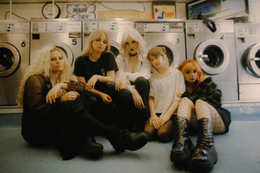 The five members of the band Venus Grrrls