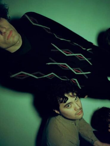 The four members of the band slate