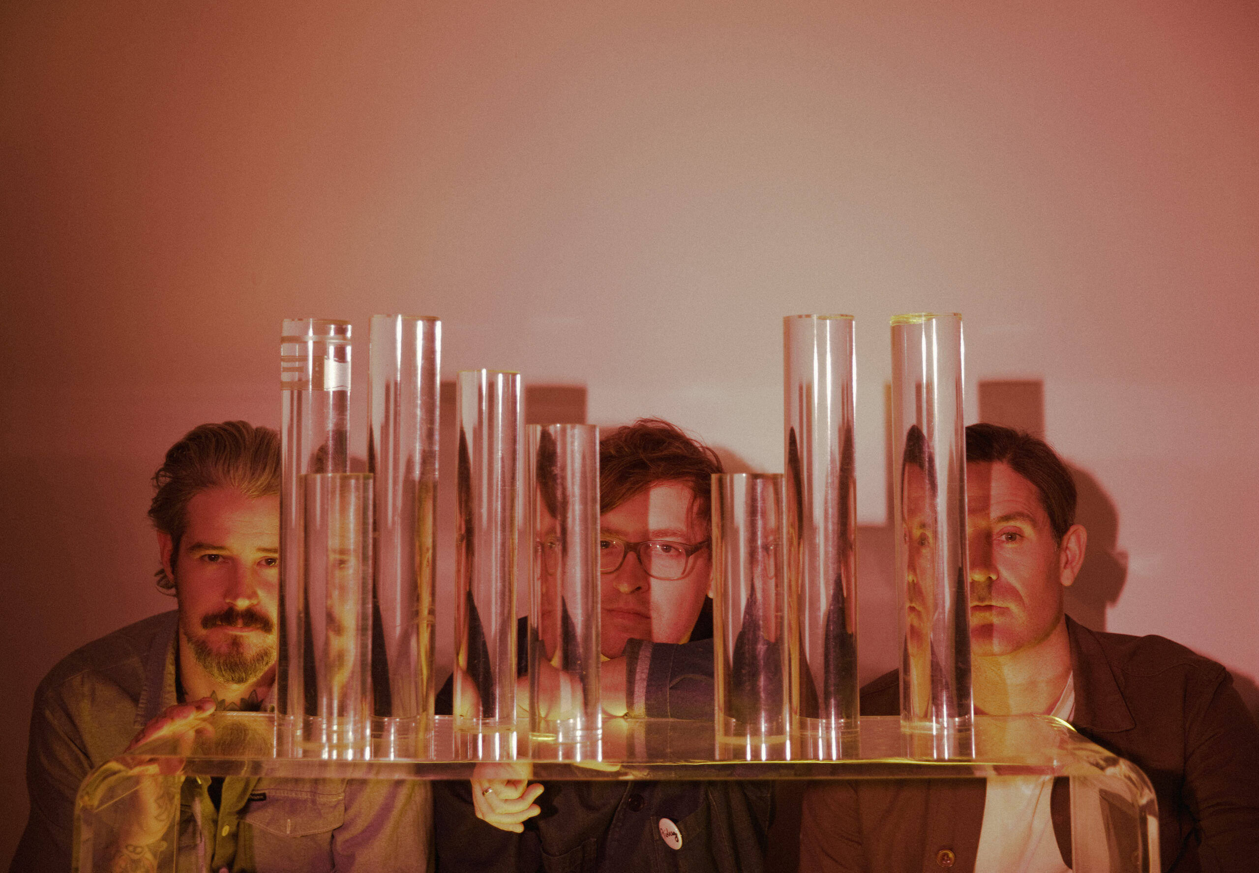 The three band members of METZ