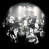 Black and white photo of the band university on stage