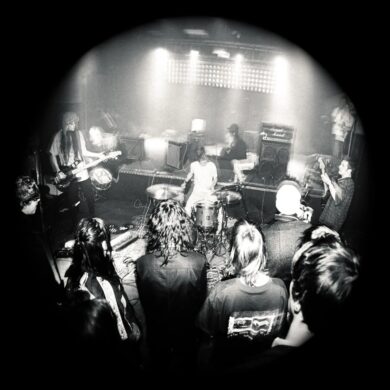 Black and white photo of the band university on stage