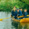 The five members of the band Eades in a canoe