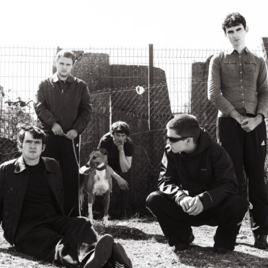 Black and white photo of the six members of the band Cardinals