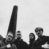 Black and white photo of four members of Maruja