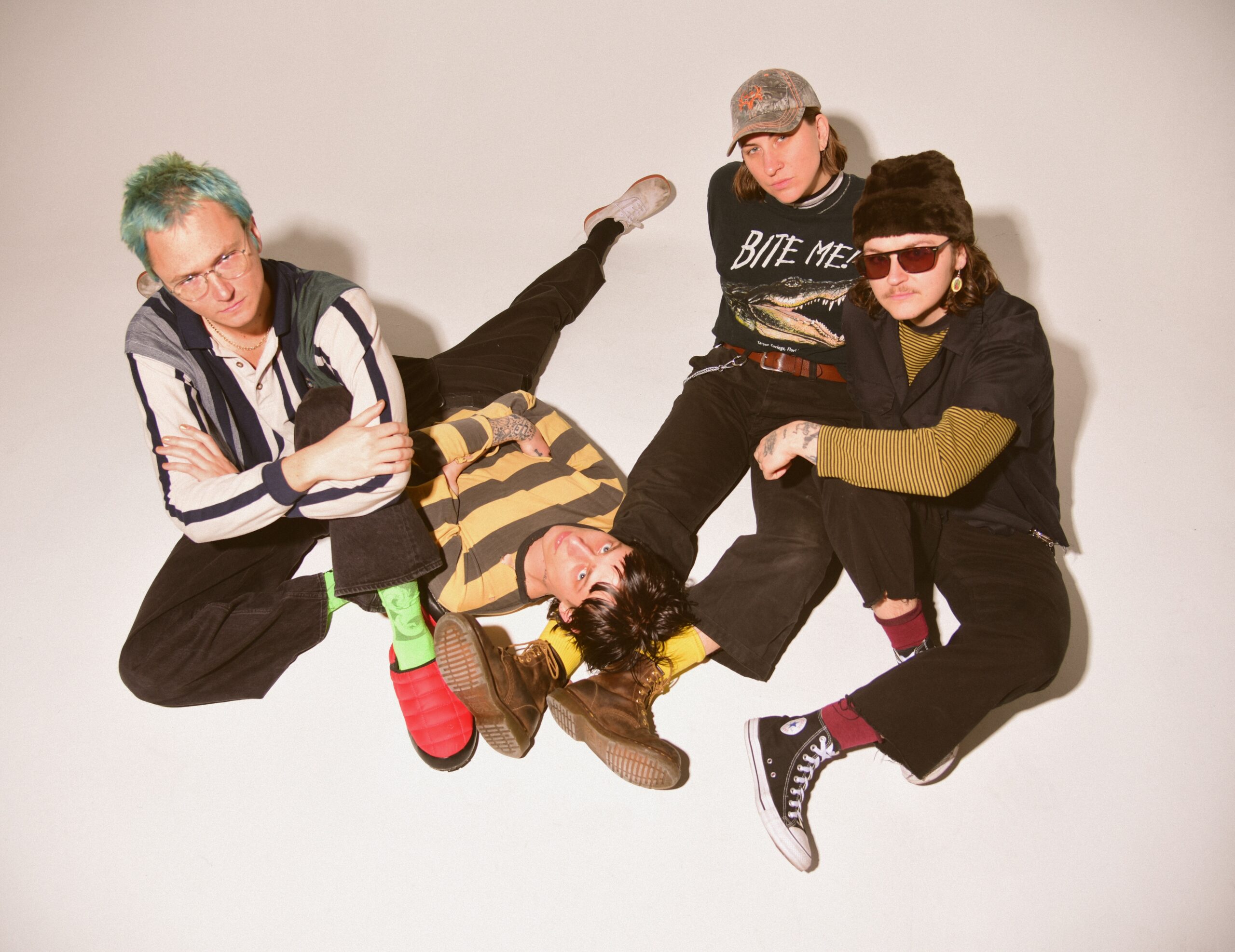 The four band members of Thus Love
