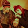 The three members of the band Adore