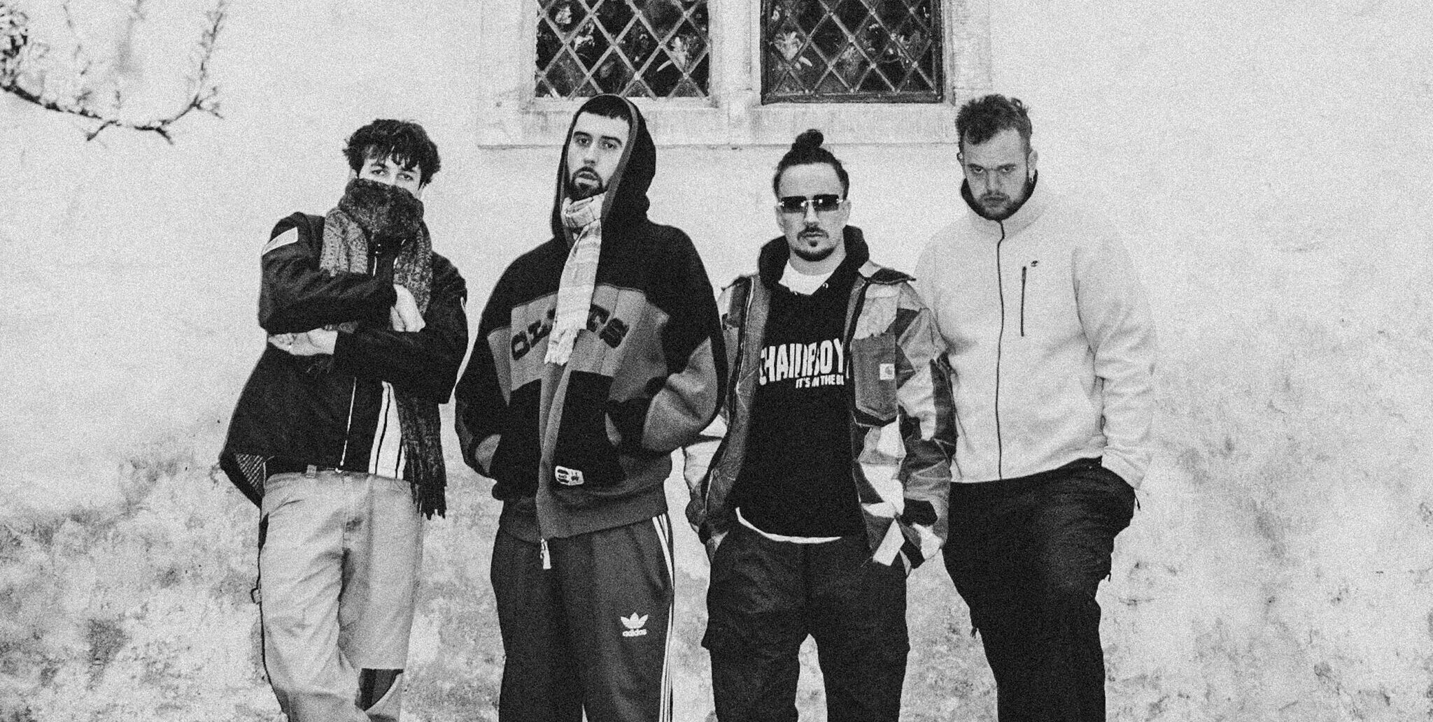 Black and white photo of the four members of band Maruja