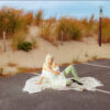 girlpuppy sitting on the floor in a car parking space by the beach